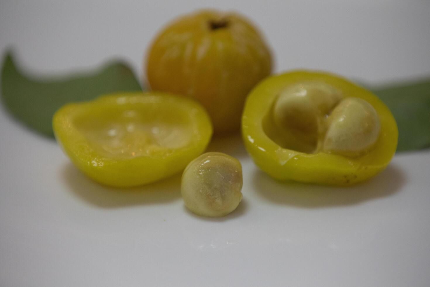 Ripe edible wild fruit from the Brazilian cerrado biome, fruit known as cagaita Stenocalyx dysentericus of the Magnoliopsida class and the Myrtaceae family. photo