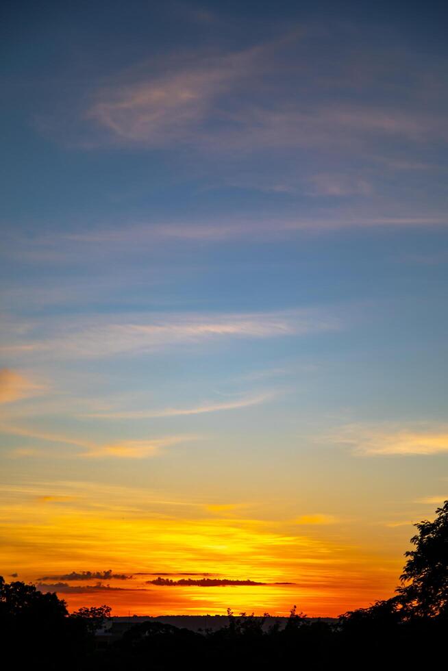 Sunrise with intense natural orange lights and idyllic dramatic scenery photo