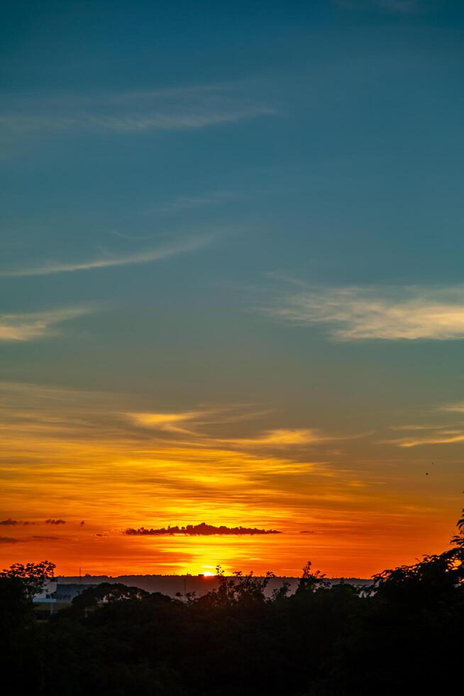 Sunrise with intense natural orange lights and idyllic dramatic scenery photo