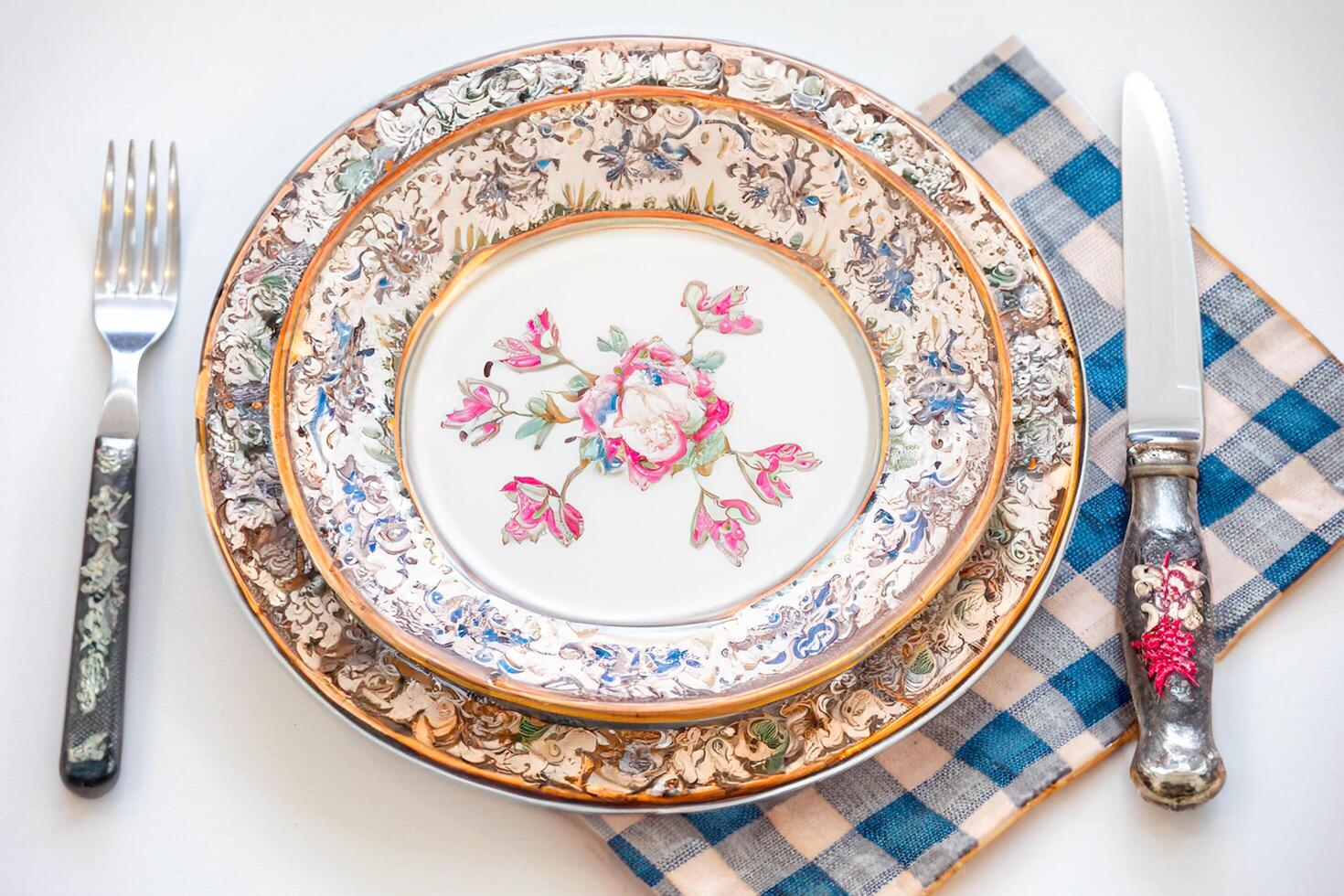 Empty plate top view with metal cutlery next to it photo