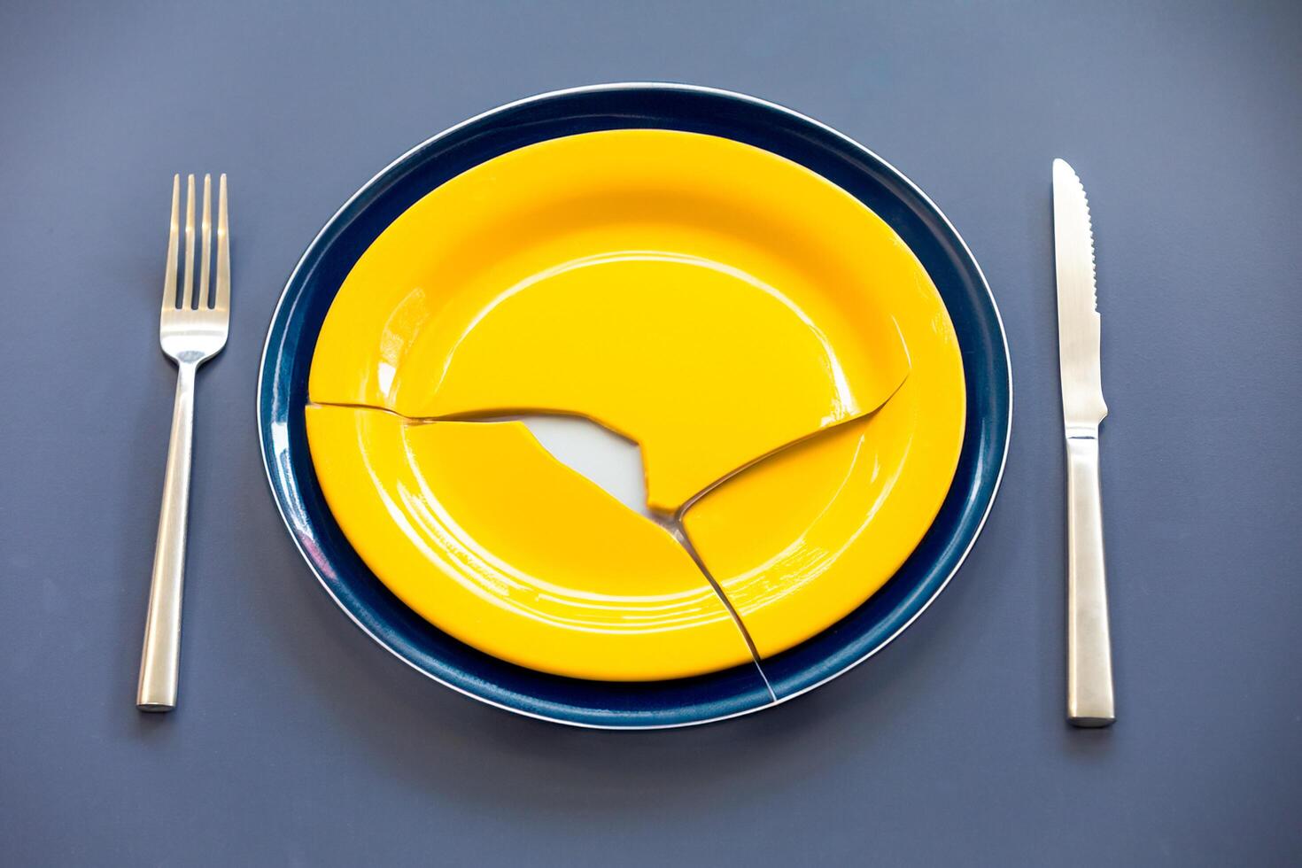 Empty plate top view with metal cutlery next to it photo