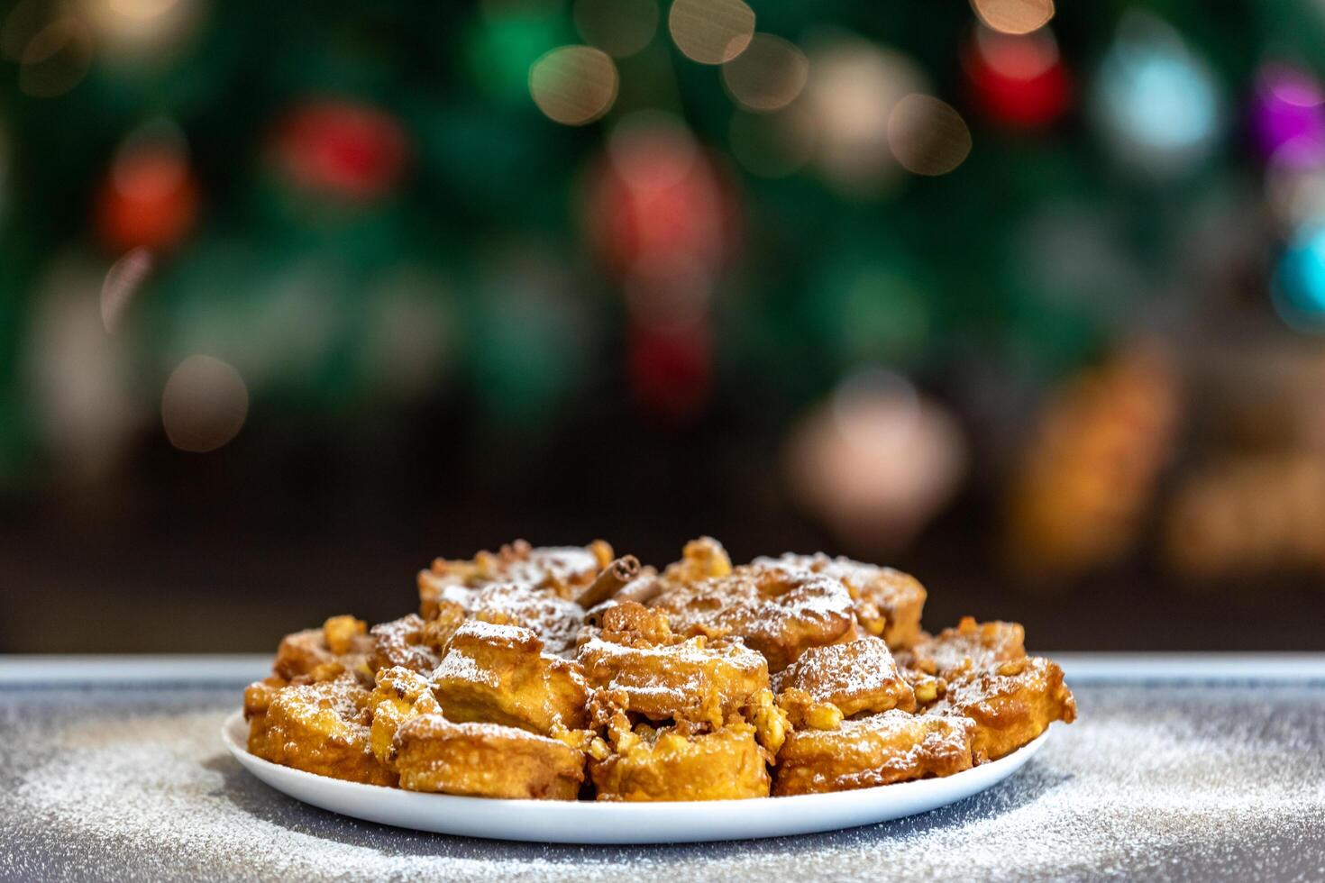 Authentic sweet Christmas French toast served with sugar and cinnamon in a Christmas atmosphere photo