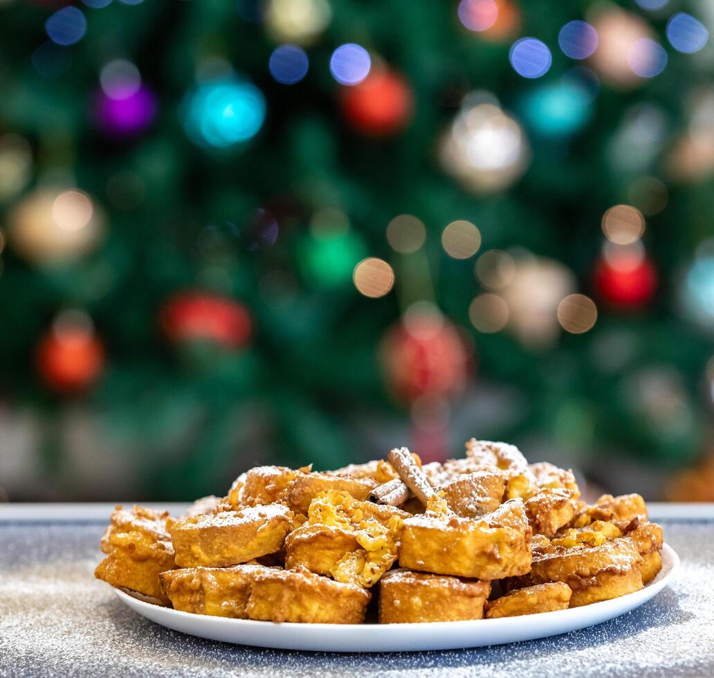 Authentic sweet Christmas French toast served with sugar and cinnamon in a Christmas atmosphere photo