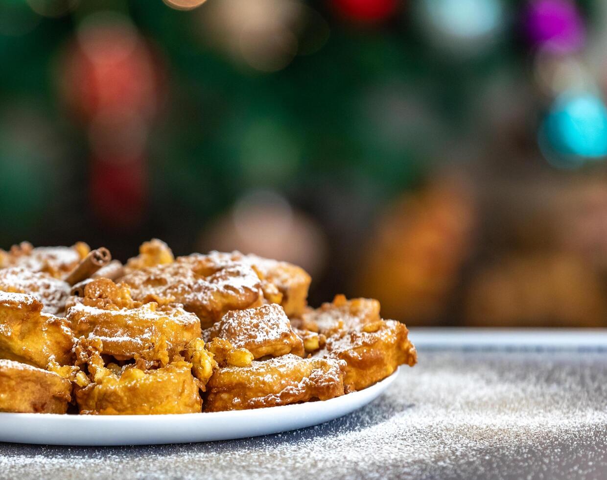 Authentic sweet Christmas French toast served with sugar and cinnamon in a Christmas atmosphere photo