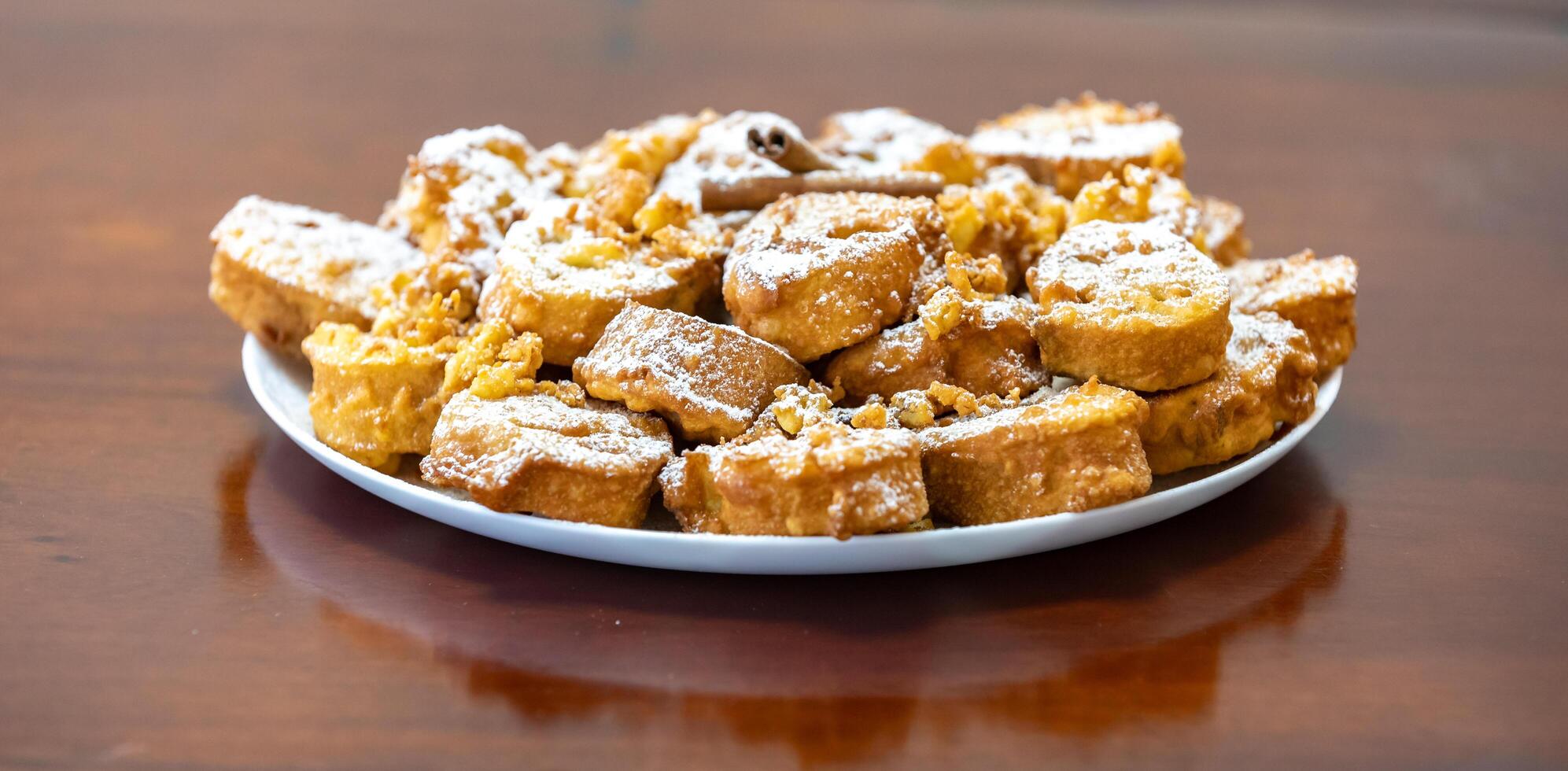 Authentic sweet Christmas French toast served with sugar and cinnamon in a Christmas atmosphere photo