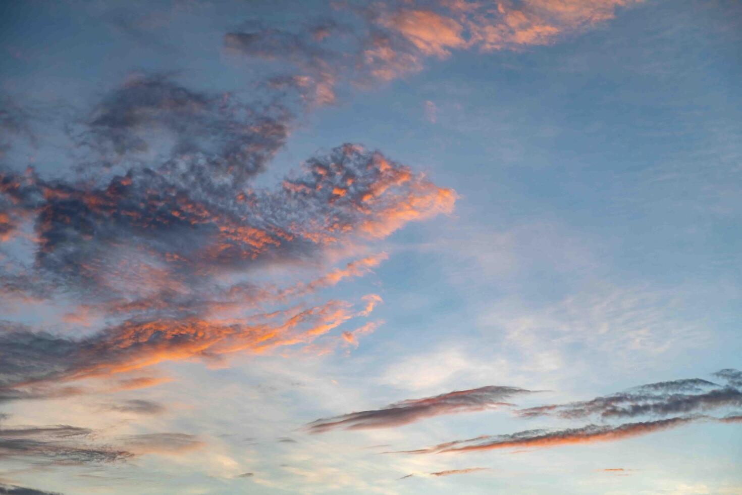 Sunrise with intense natural orange lights and idyllic dramatic scenery photo