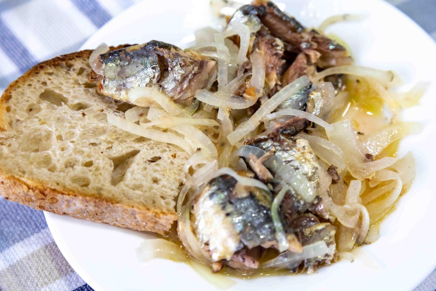 Pickled sardines with onion and vinegar photo