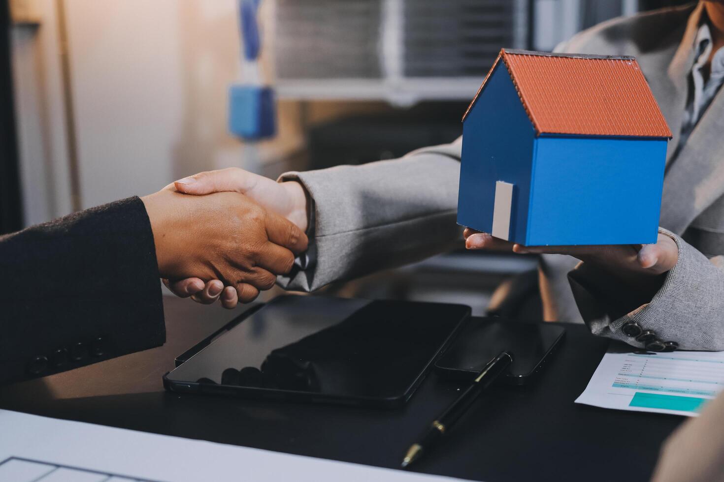 Close up Business people or Real Estate agent explain signing agreement for sale house to client. Property, Insurance, Broker concept. photo