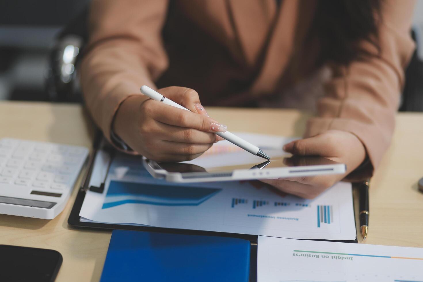 business documents businessman check legal document review Prepare documents or analysis reports, tax items, accounting documents, data contracts, office partner agreements. photo