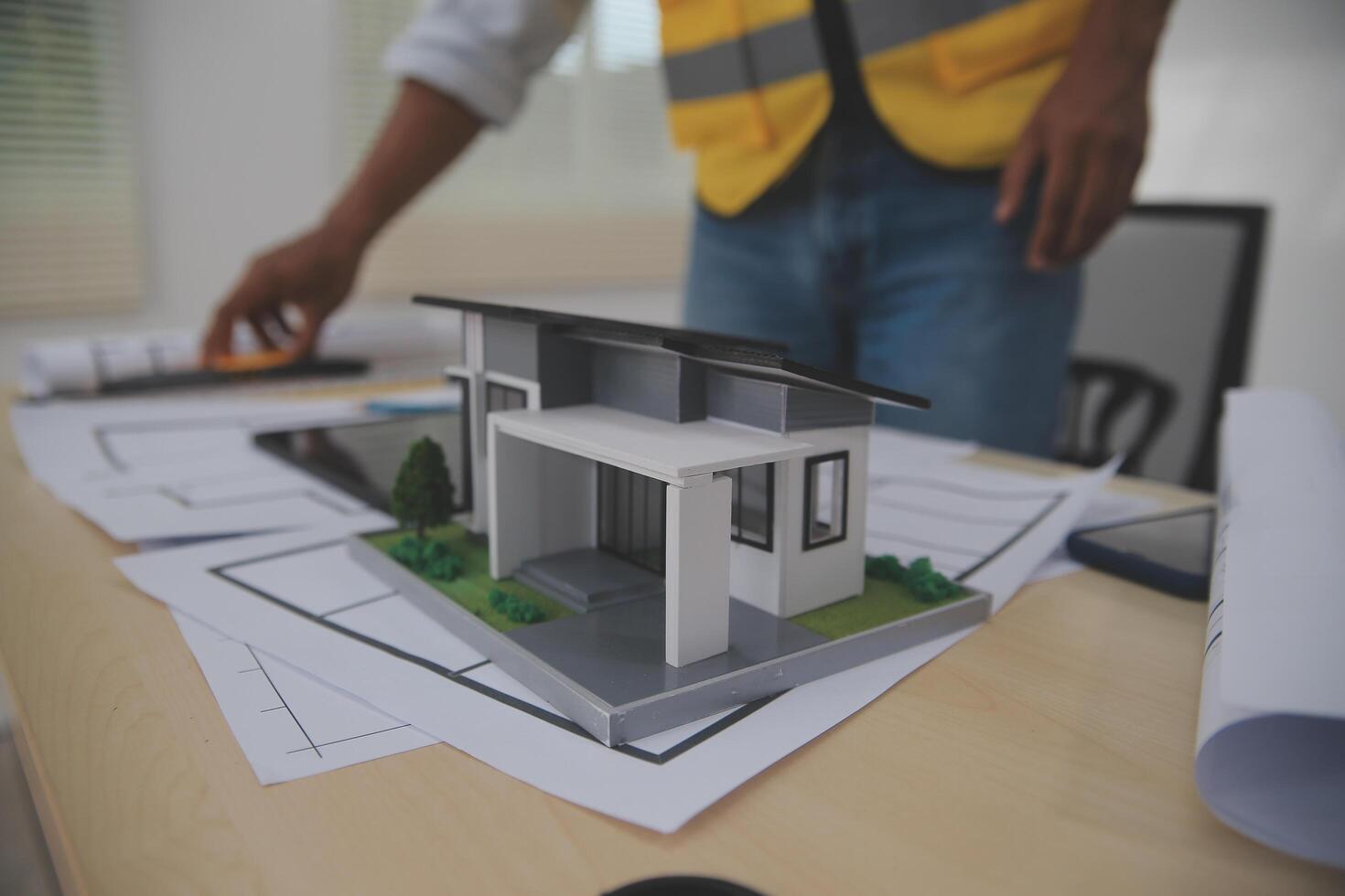 Image of engineer meeting for architectural project. working with partner and engineering tools on workplace vintage tone. photo