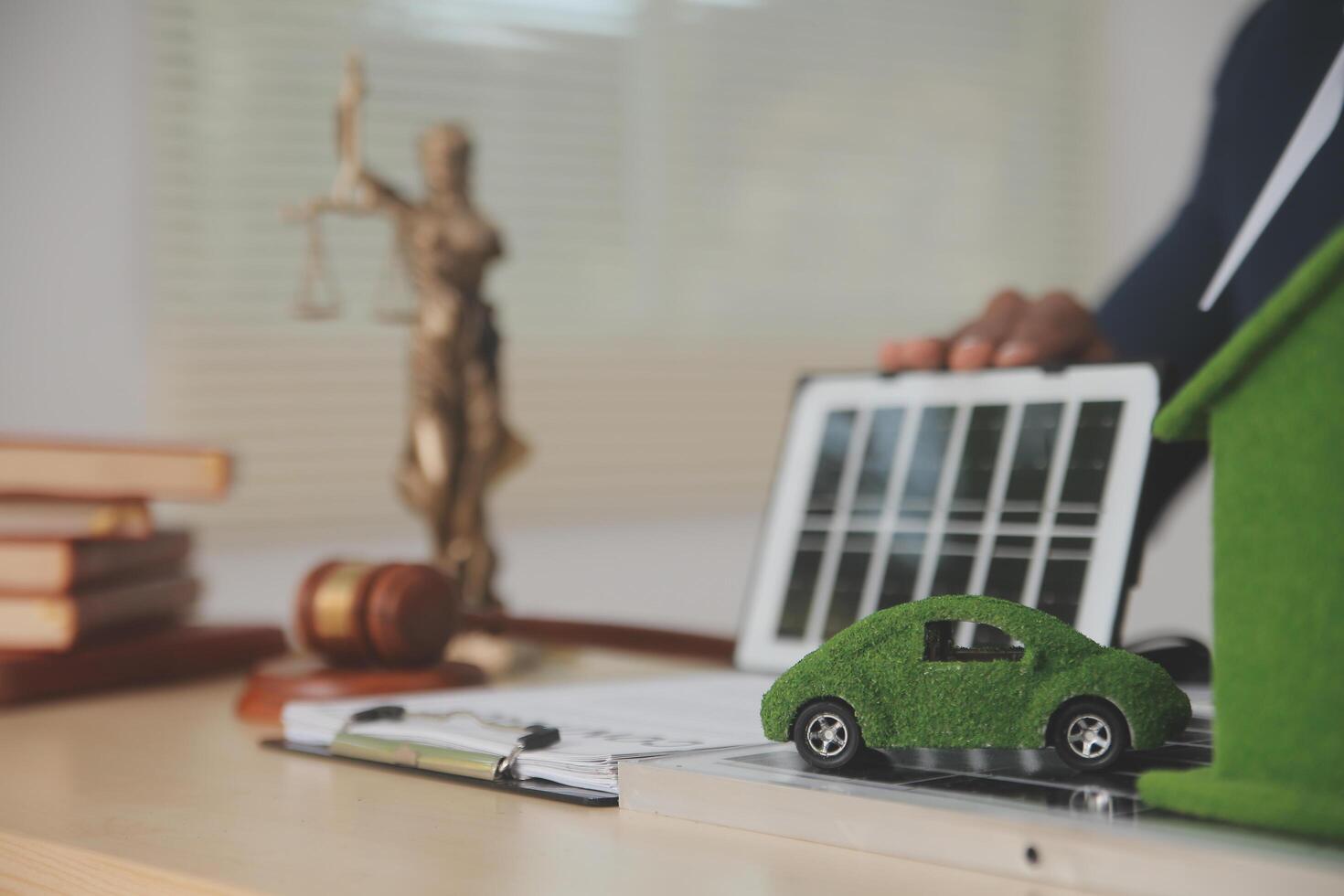 Auctioneer knocks down property sale by sample house and lawyer's gavel, judge mediates in property dispute in court car judge's gavel on wooden background Buying and selling real estate, housing photo