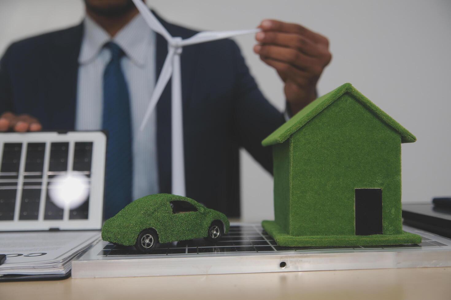 Auctioneer knocks down property sale by sample house and lawyer's gavel, judge mediates in property dispute in court car judge's gavel on wooden background Buying and selling real estate, housing photo