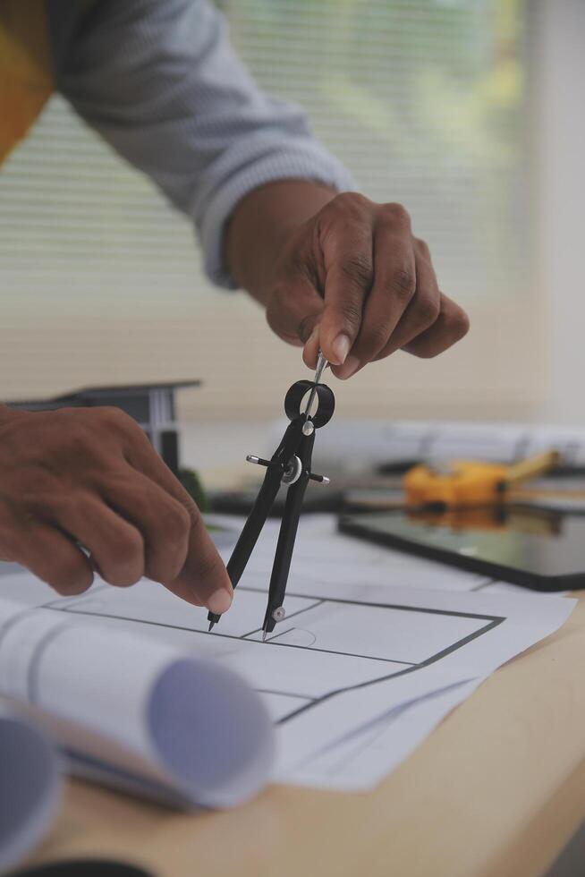 Image of engineer meeting for architectural project. working with partner and engineering tools on workplace vintage tone. photo