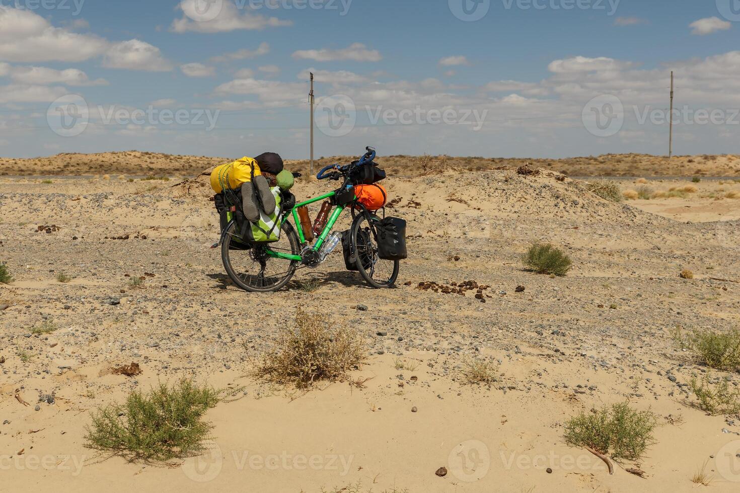 a bicycle for a traveler stands in the steppe of Kazakhstan photo