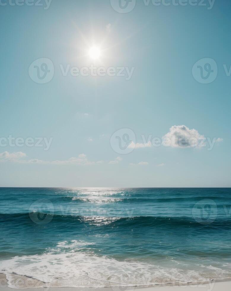 The ocean is blue and the sun is shining brightly. photo