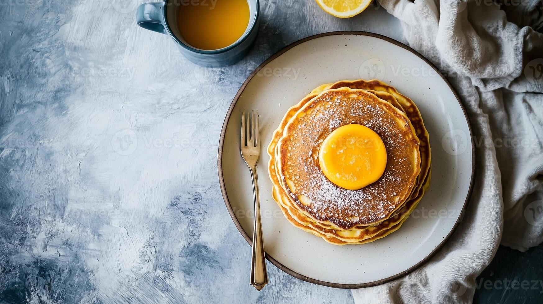Breakfast table setting with a stack of buttermilk pancakes on one plate, culinary photography photo