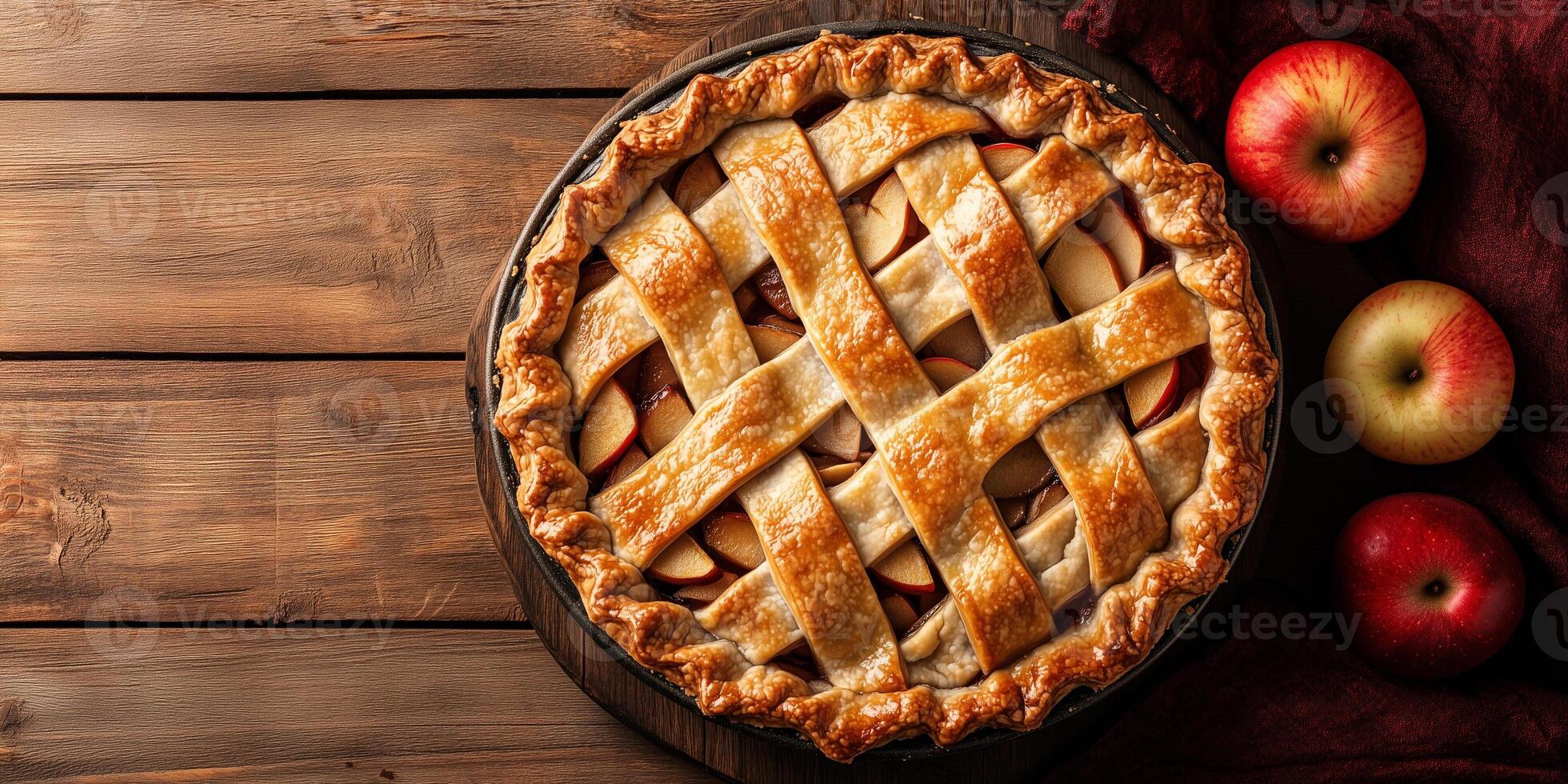 Freshly baked pie, with visible apple slices underneath a golden, crisscrossed top, food photography photo
