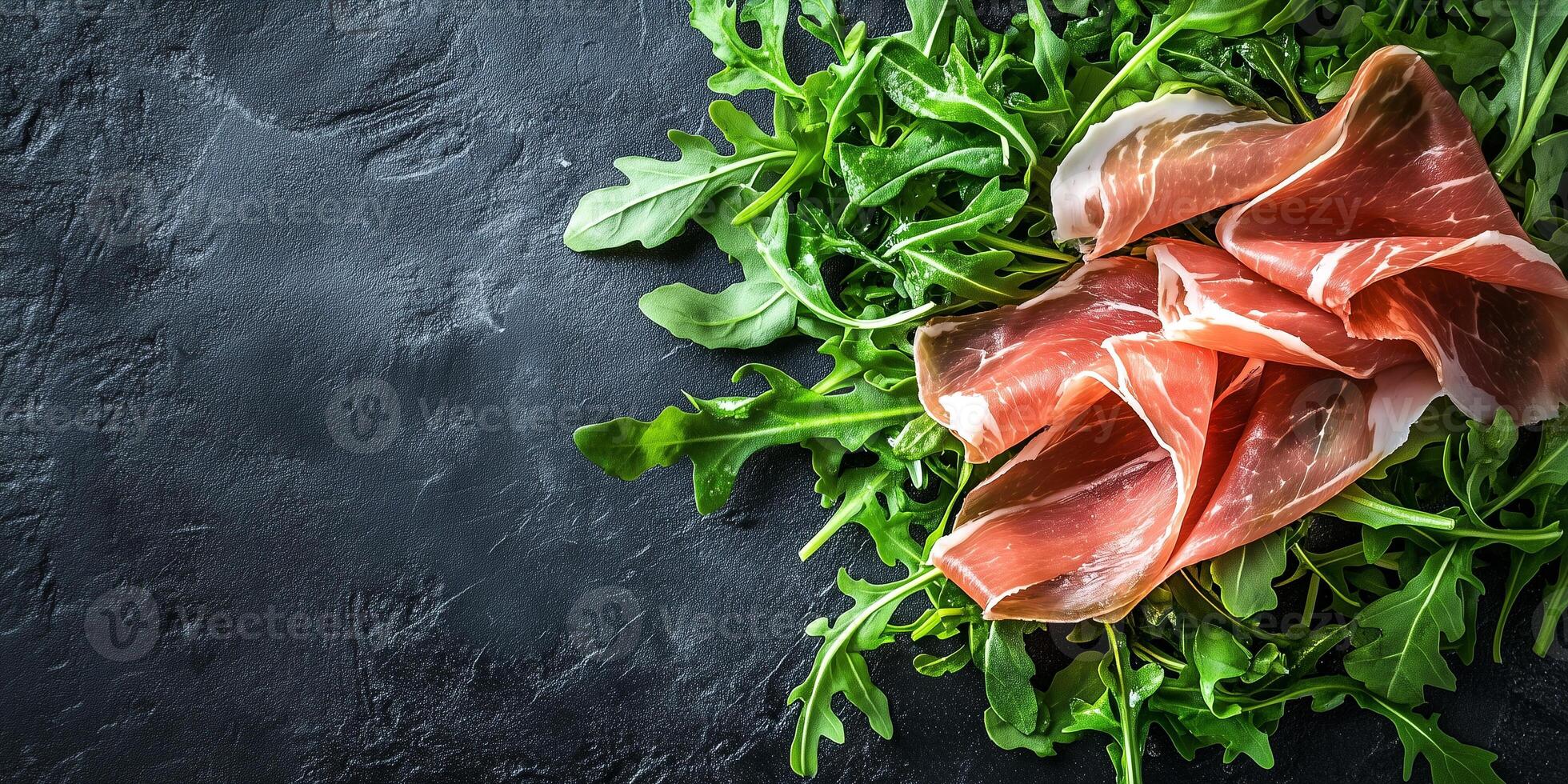 Prosciutto slices draped over a small pile of arugula leaves, culinary photography photo
