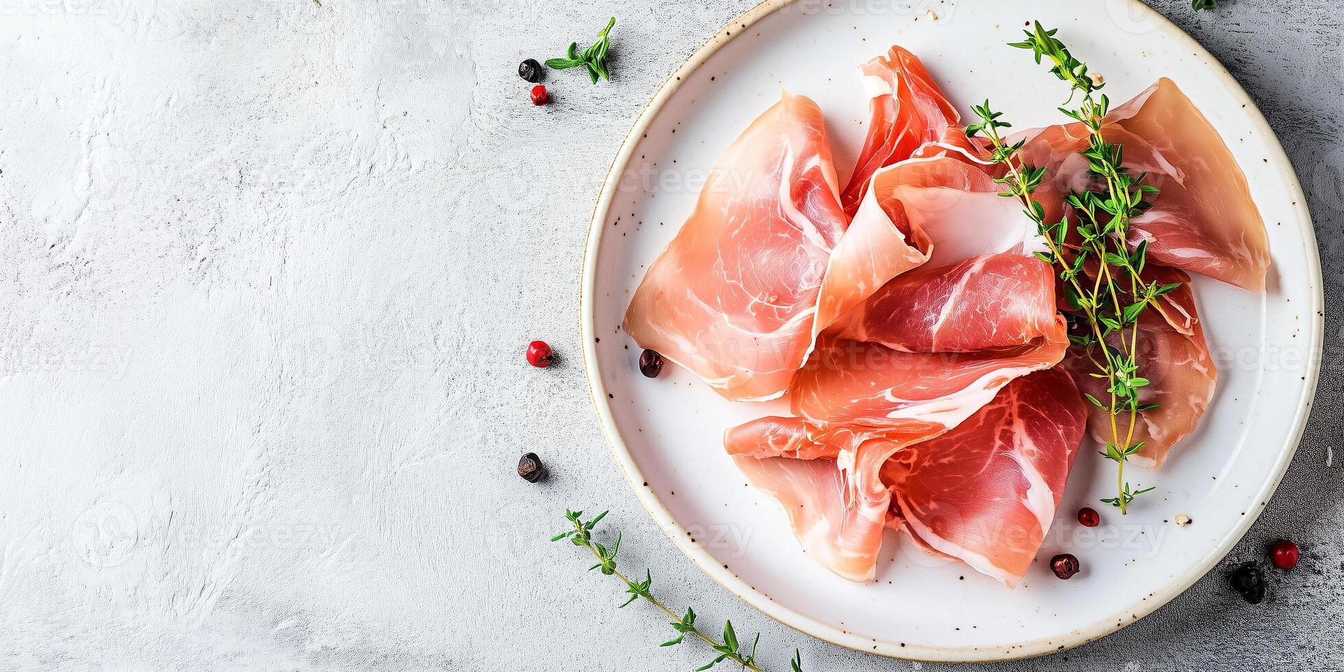 Prosciutto slices displayed on a white plate, with a sprig of fresh herbs, gastronomy photography photo