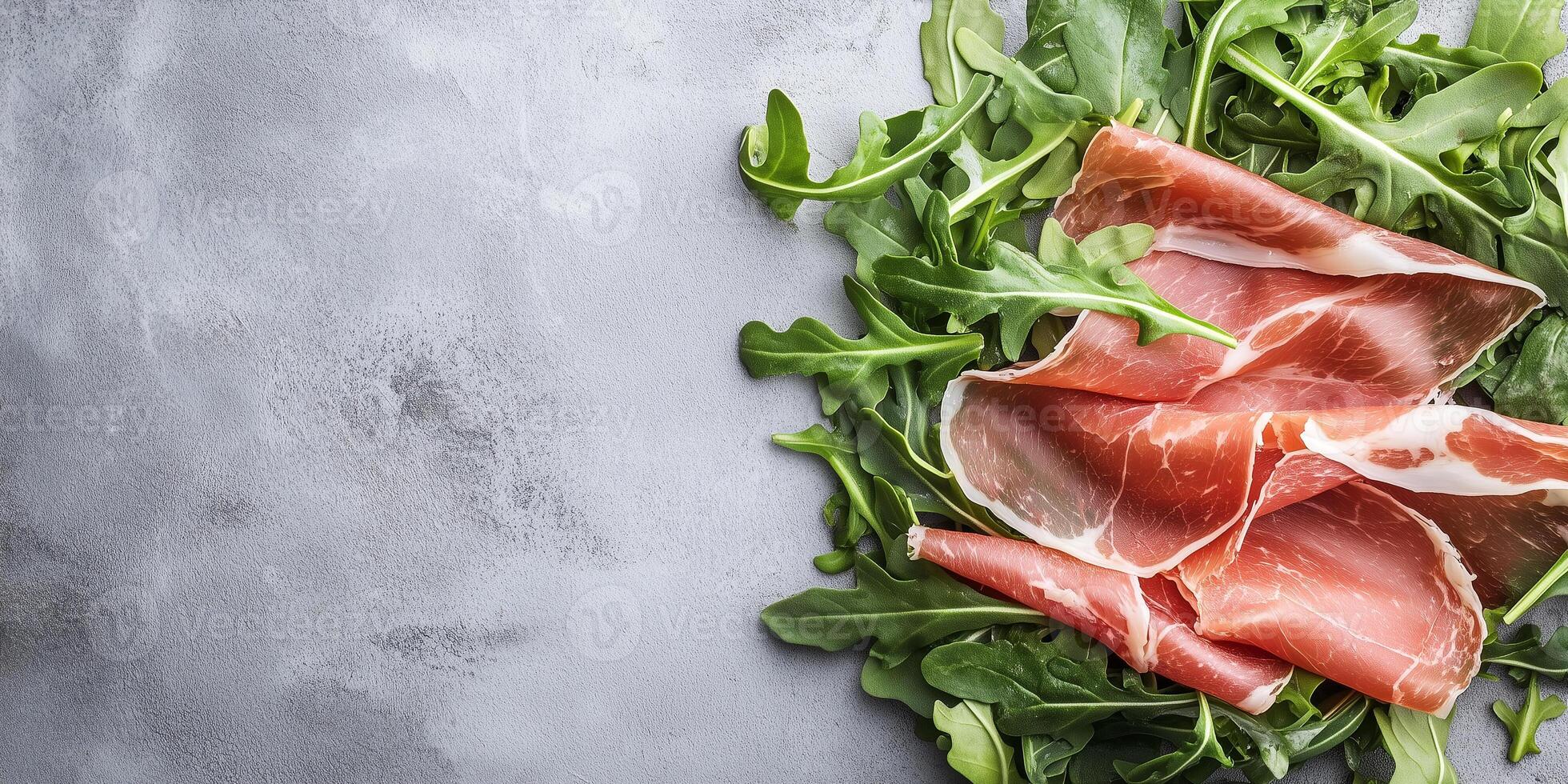 Prosciutto slices draped over a small pile of arugula leaves, gastronomy photography photo
