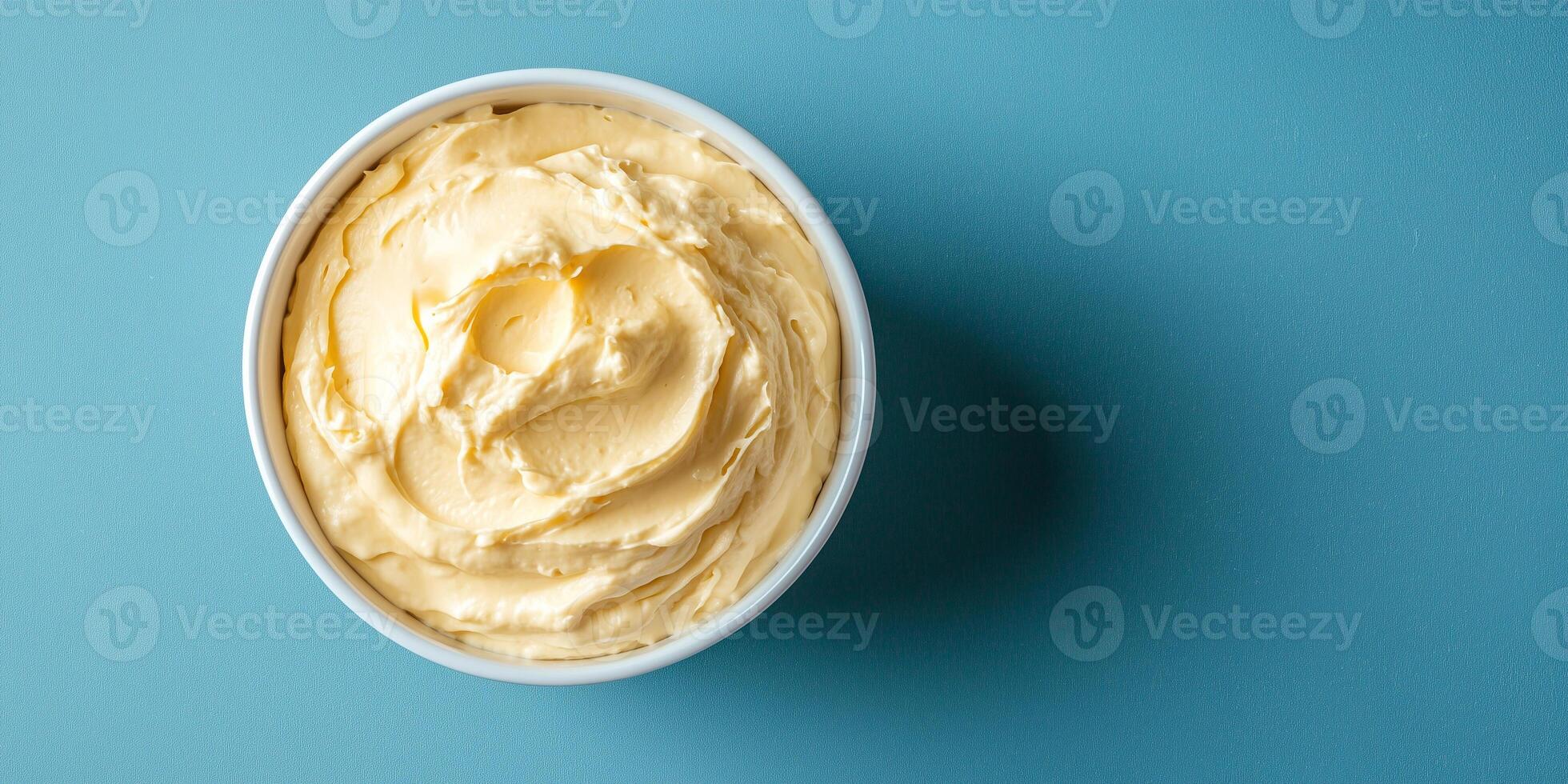 Serving of spread in a simple dish with no visible toppings or decorations, food setting photo