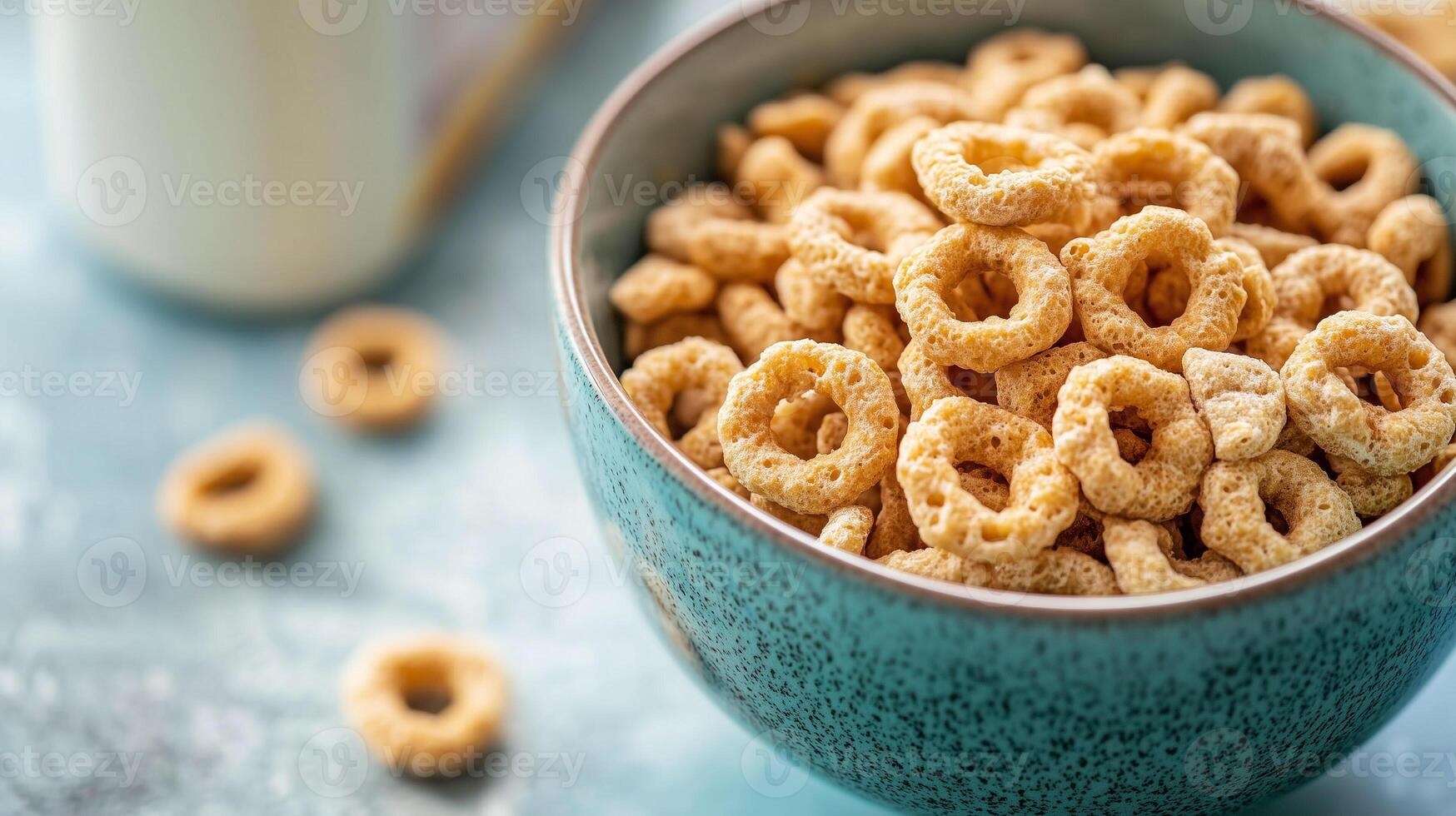 Close-up view of cold cereal pieces in a bowl with milk carton behind, meal photography photo