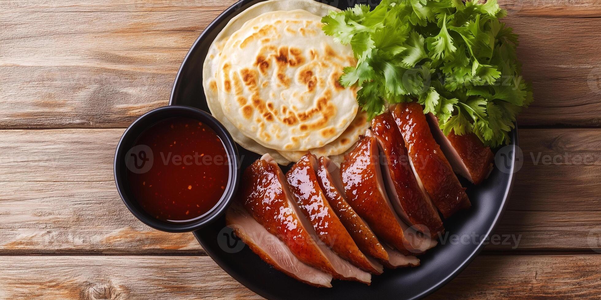 Peking duck with dipping sauce and pancakes, food setting photo