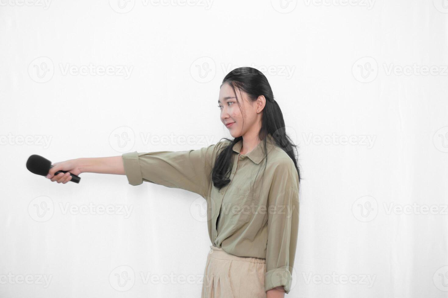 Expression of Indonesian Asian woman in green dress singing photo