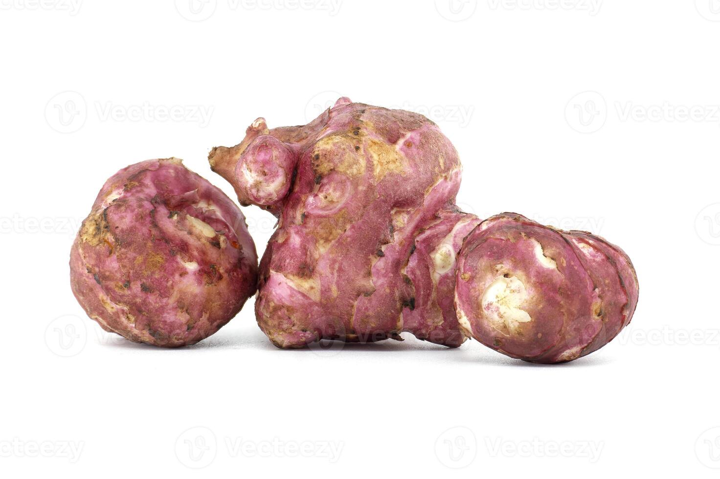 Close-Up of Fresh Jerusalem Artichokes on White Background photo