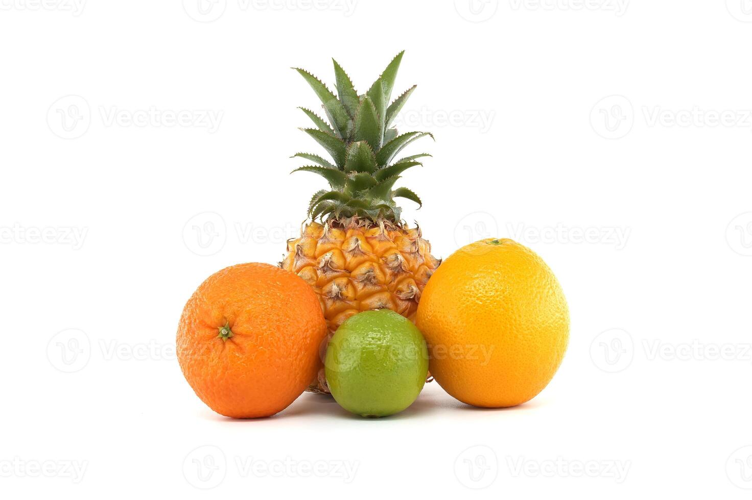 Assorted Fresh Fruits Including Pineapple Orange Lime Lemon and Grapefruit photo