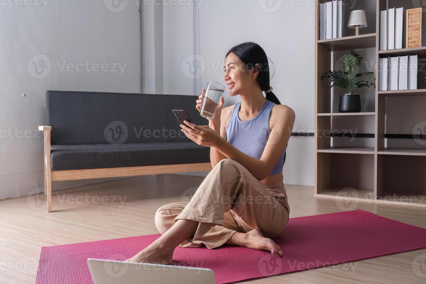 Serene Woman Practicing Yoga in Modern Living Room with Natural Light and Minimalist Decor photo
