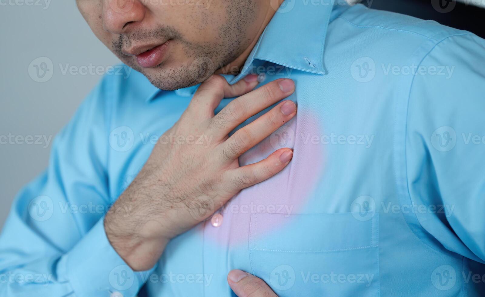 Sick man experiences chest pain at home medical situation indoor close up health concern for seo impact photo
