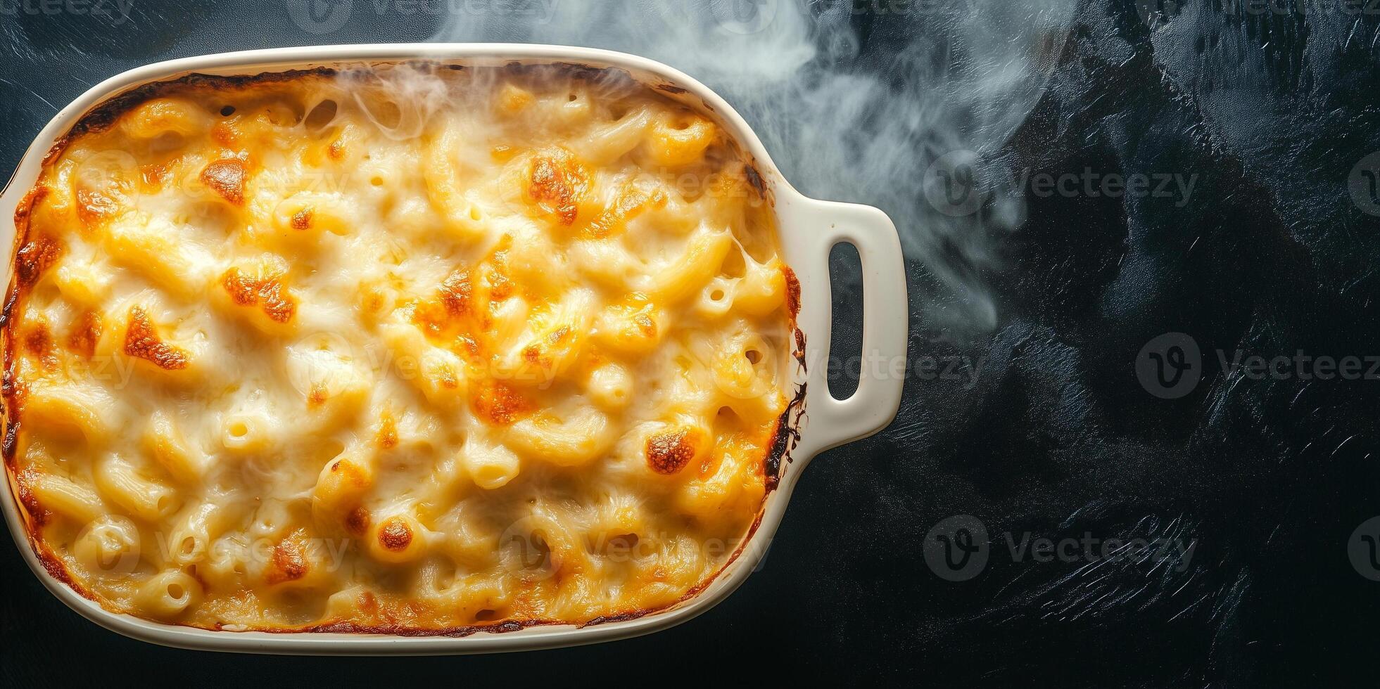 Baked mac and cheese with steam rising from the surface, food setting photo