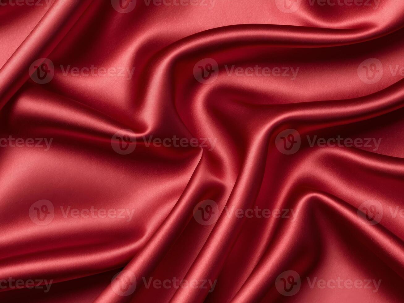 close up of red satin silk fabric background with smooth folds. photo