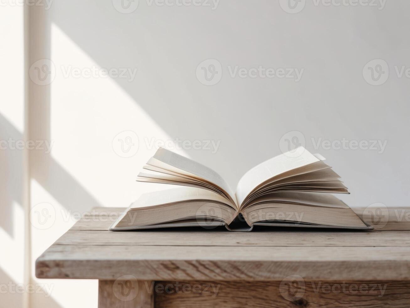 Open Book on Wooden Table - Education - Publishing and Stationery. photo