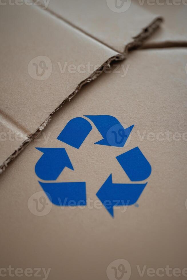 recycling symbol on a crumbled cardboard. photo
