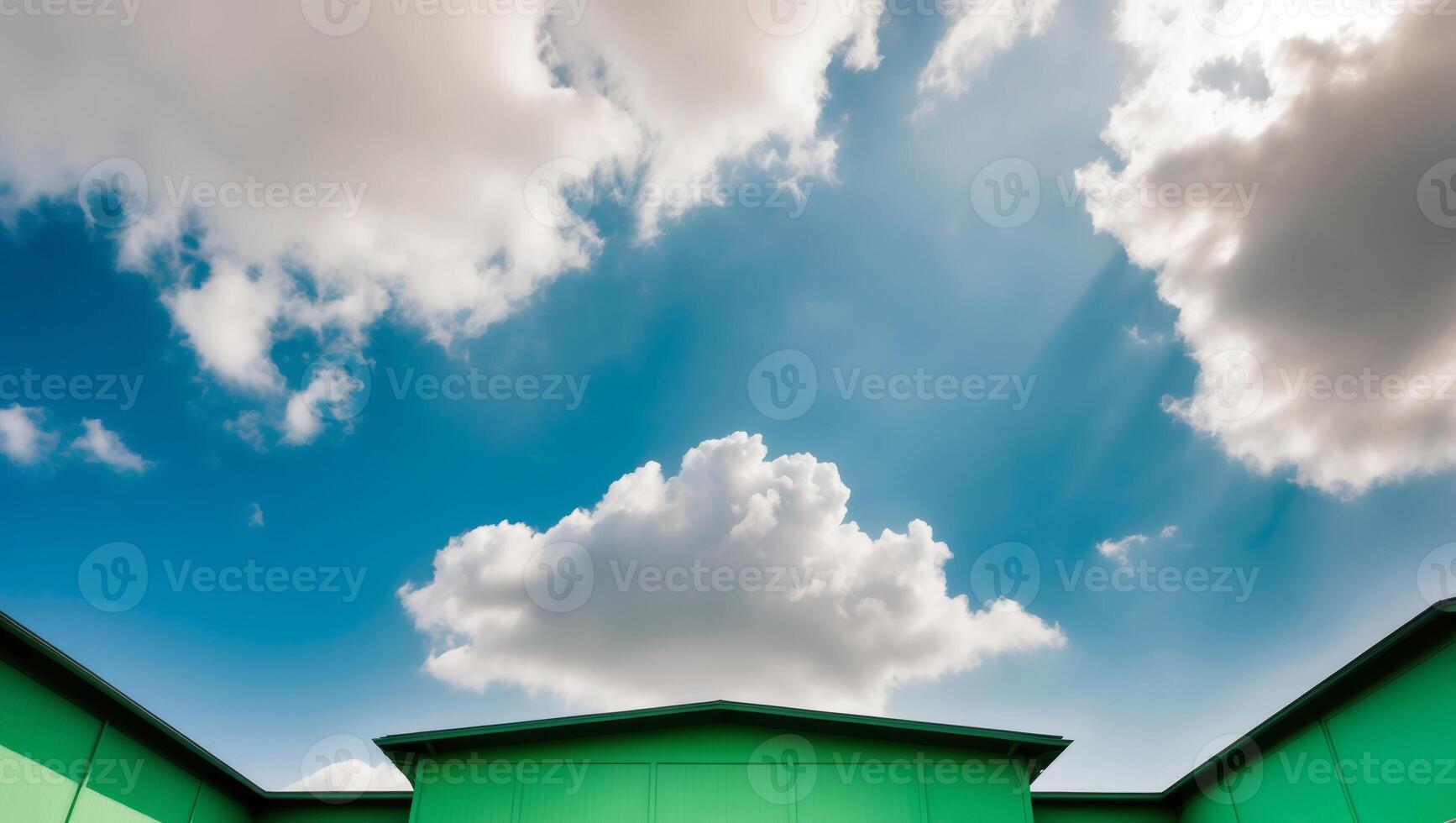 Green Facade Building with Blue Sky and White Clouds. photo