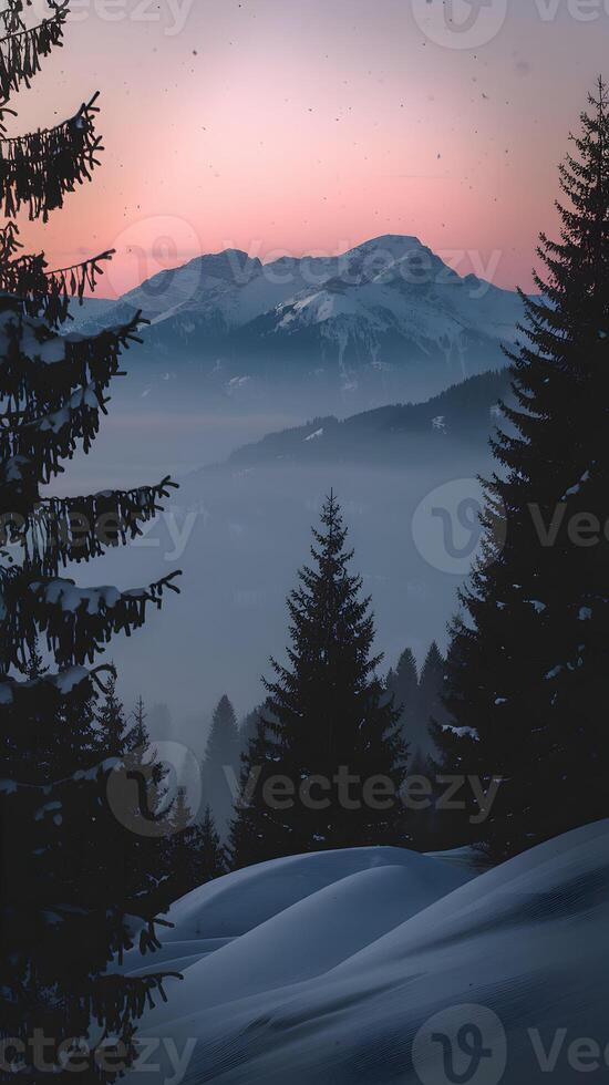 Snow covered hills lead to misty mountains under a gradient dawn sky Vertical Mobile Wallpaper photo