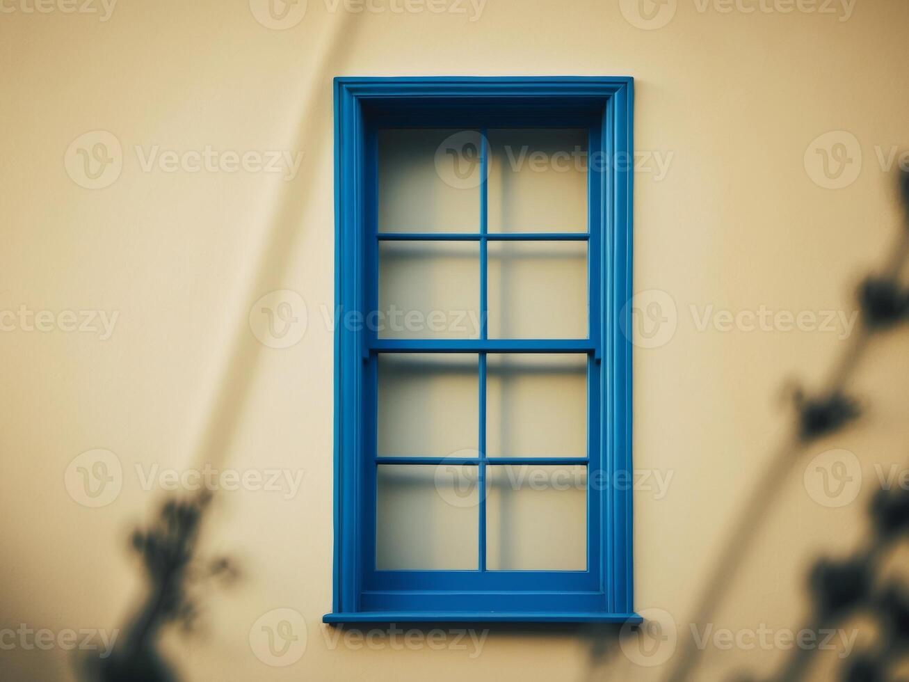 A window with a blue frame and a yellowish tint. photo