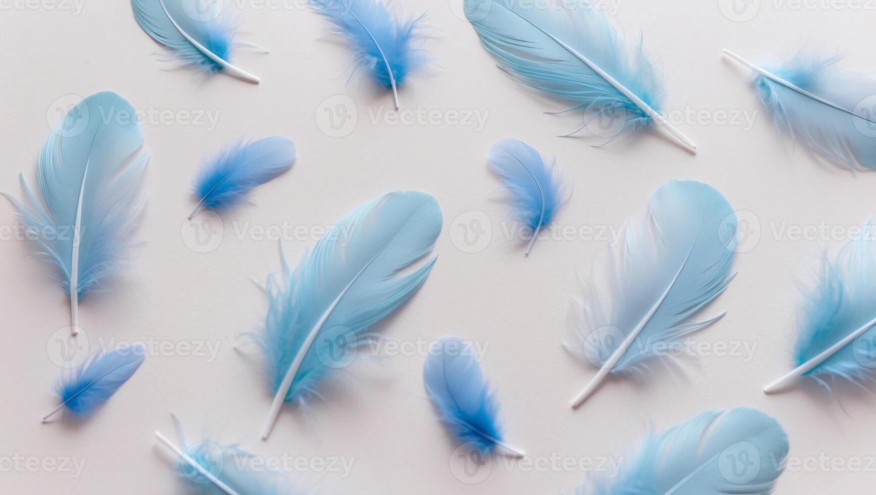 angelic pastel tinted blue feather background small fluffy blue feathers randomly scattered forming a background. photo