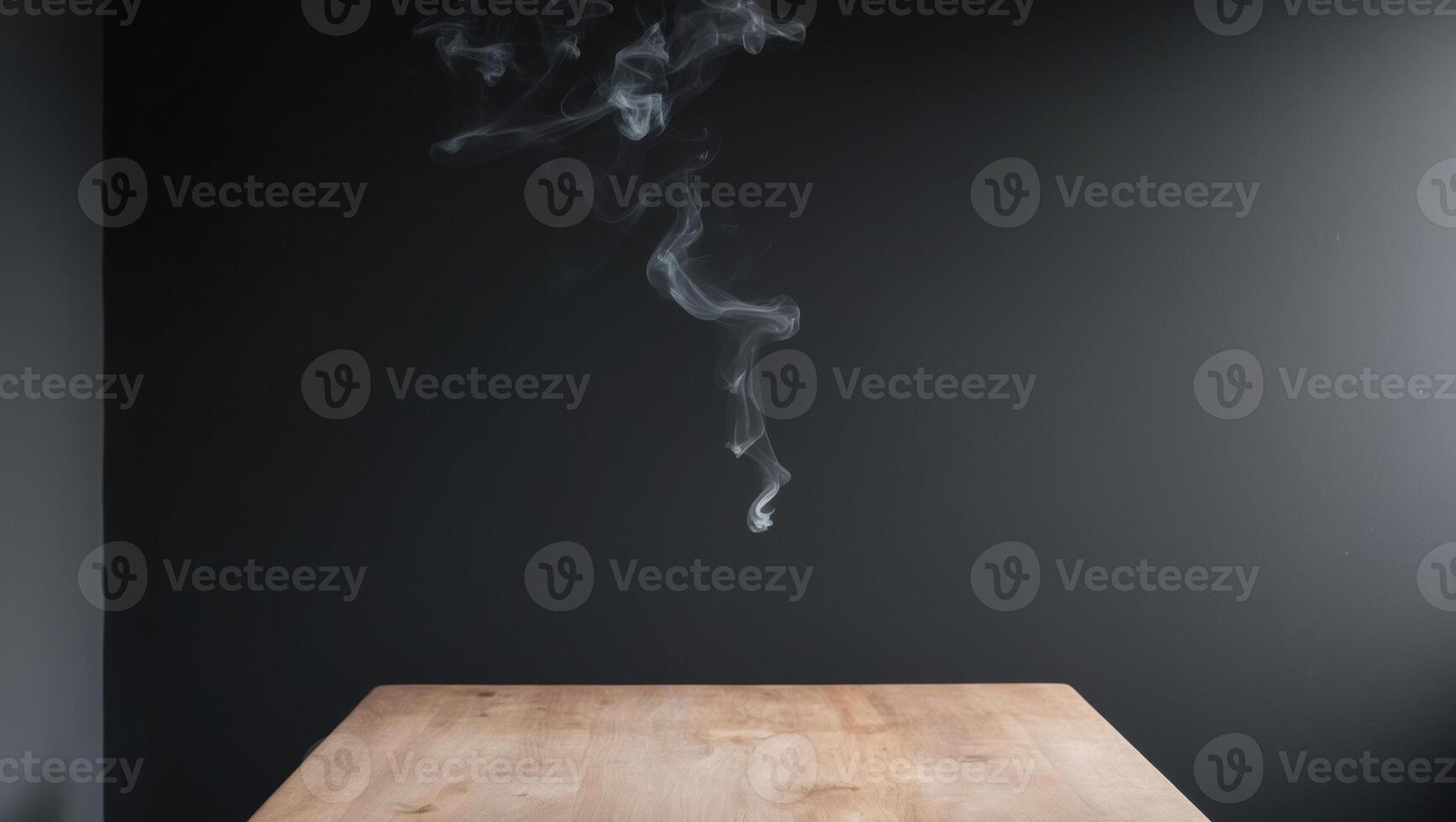 empty wooden table with smoke float up on dark background. photo
