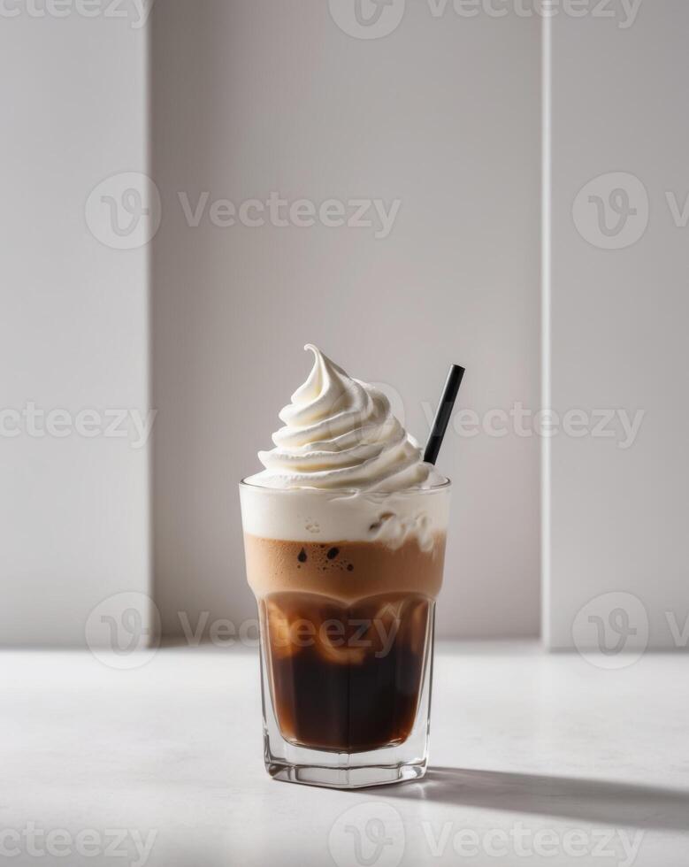 Iced Coffee with Whipped Cream Topping in a Glass - Cold Coffee Drink. photo