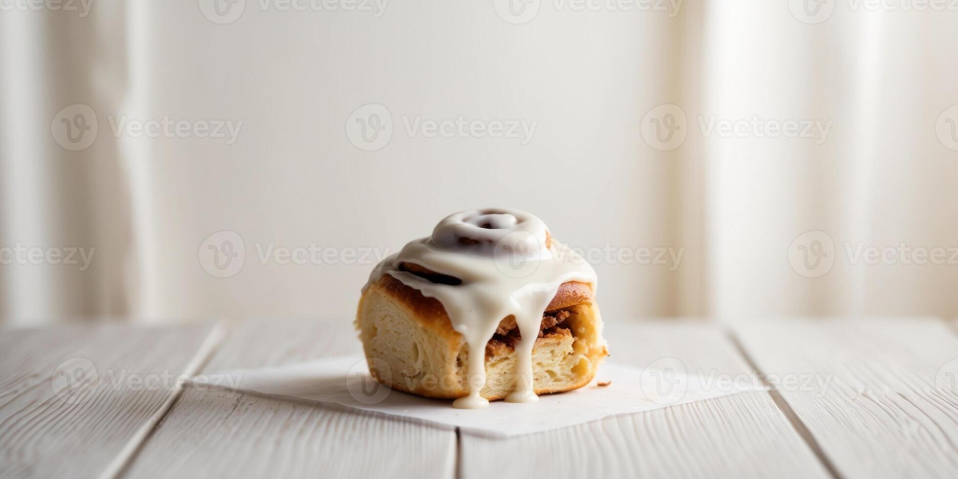 Sweet Cinnamon Roll with Creamy Icing on Rustic Wooden Surface. photo