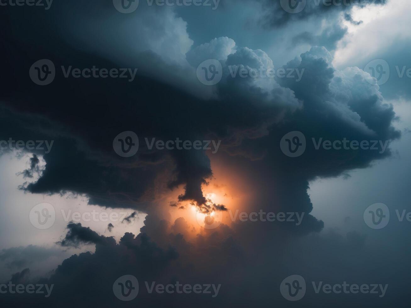 dramatic sky with dark storm clouds bright light in center. photo