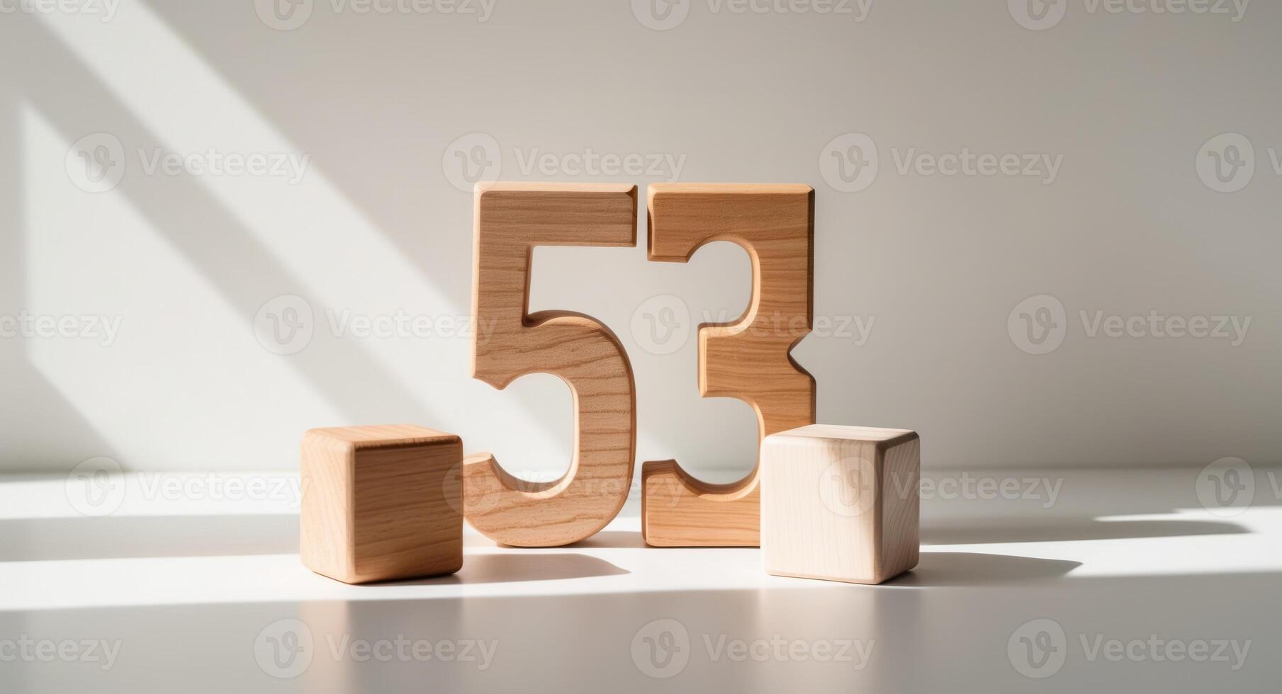 Wooden toy blocks forming the number 53. photo