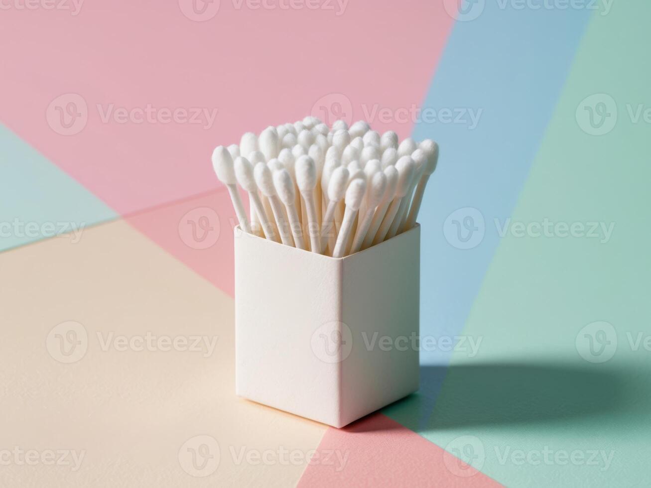 Cotton Buds in a Box on Colorful Background. photo