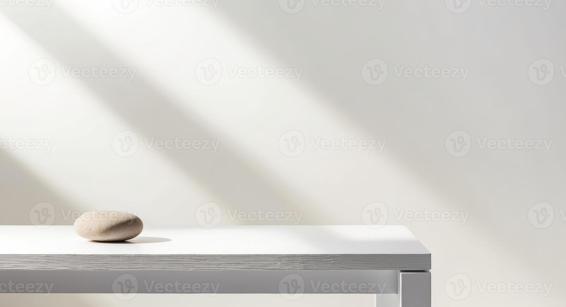 White wooden table and decorative stone for mockup or product display. photo