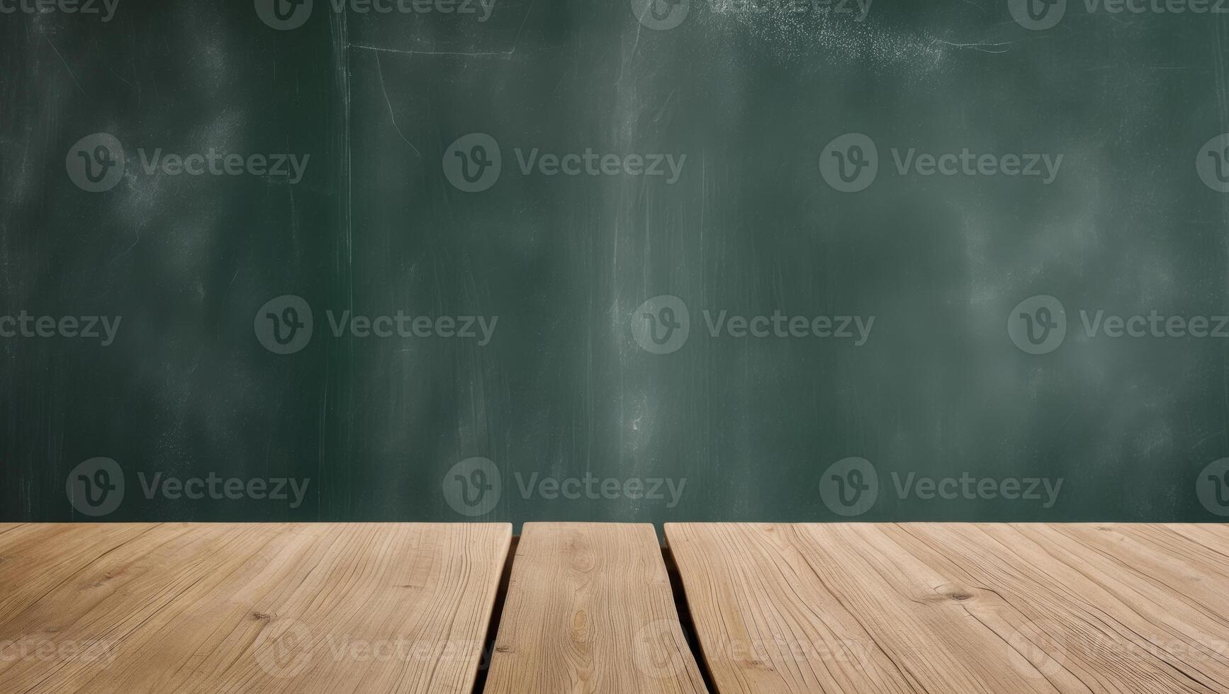 background of green chalkboard and wooden table with copy space. photo