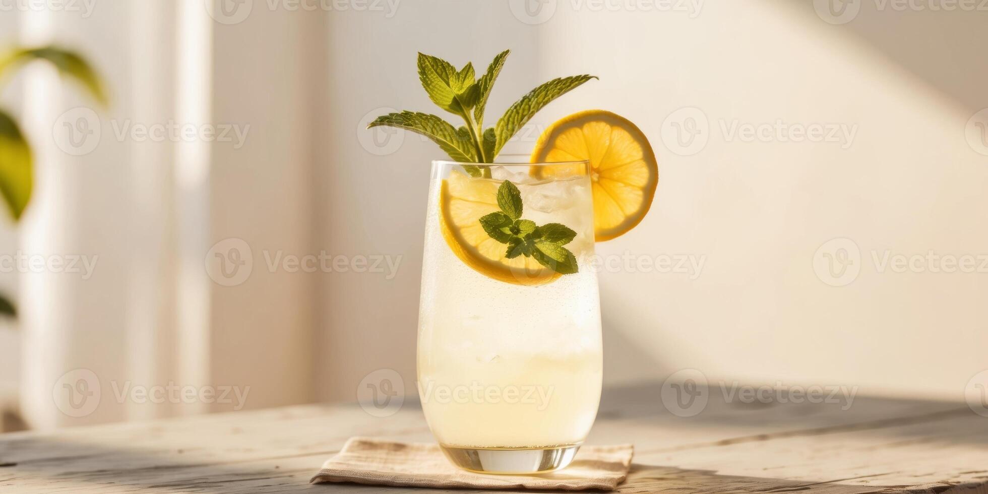 Refreshing and Inviting Glass of Sparkling Lemonade with Fresh Mint Leaves and Slices of Citrus Fruit on a Rustic Wooden Table Bathed in Warm Sunlight. photo