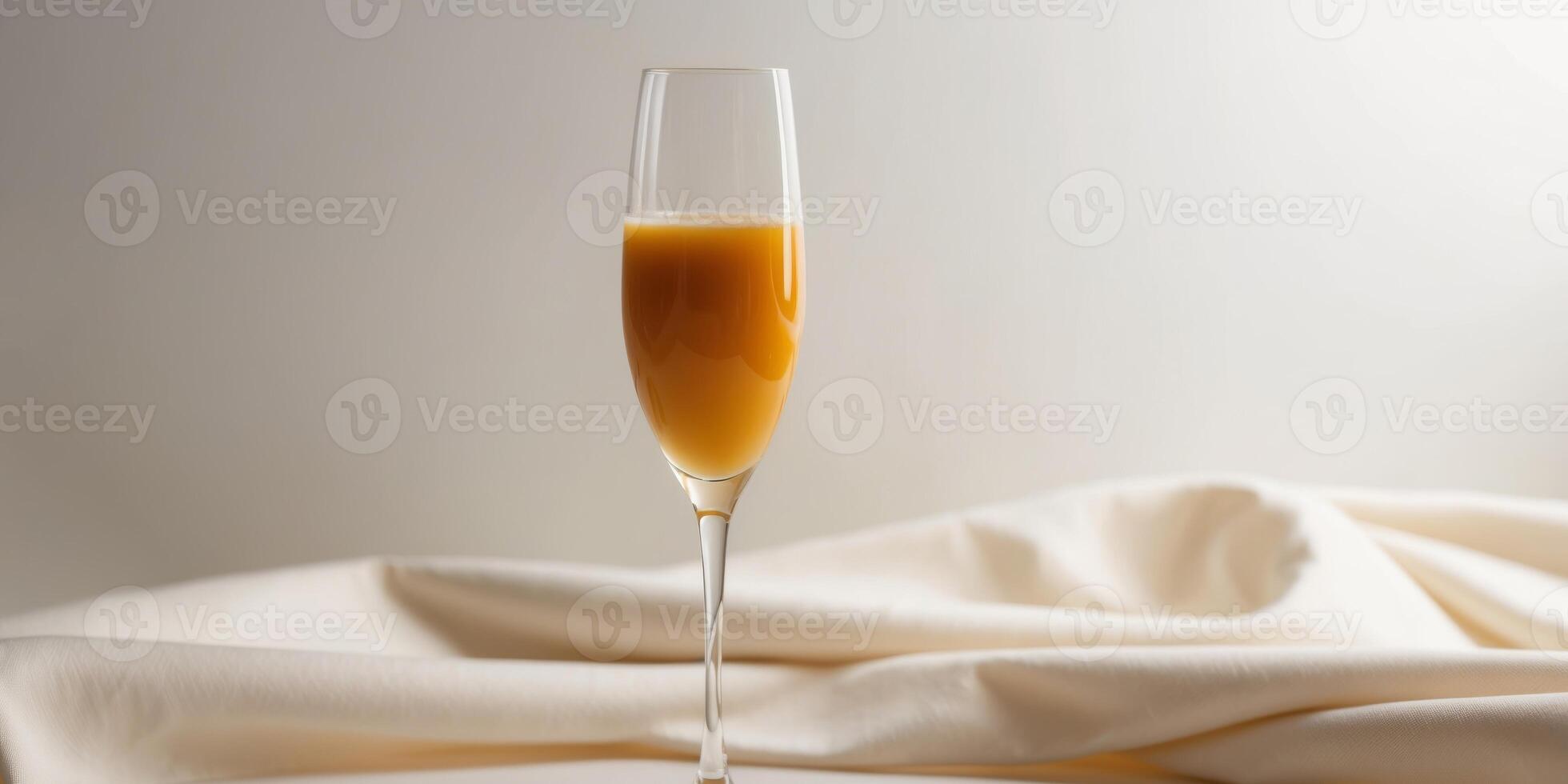 Orange juice in a champagne glass looks elegant and stylish. photo